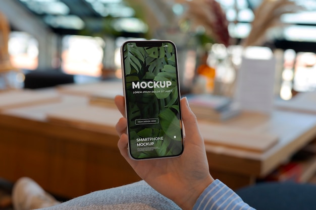 person holding a device mockup