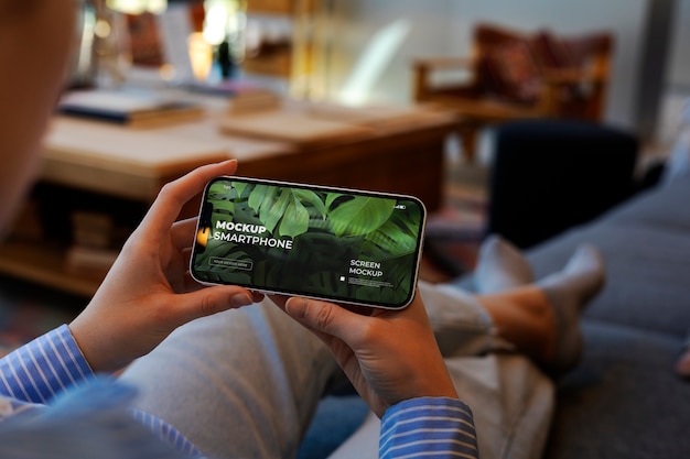 person holding a device mockup