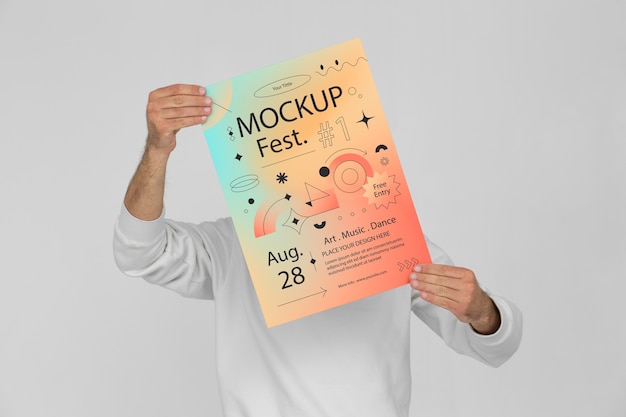 Person holding gradient poster mock-up for festival