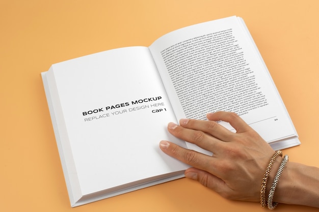 Person holding hard cover book in their hands