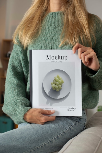 Person holding magazine mockup