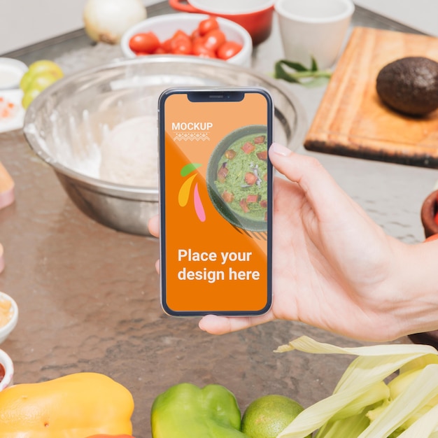 PSD person holding a mobile phone healthy food mock-up