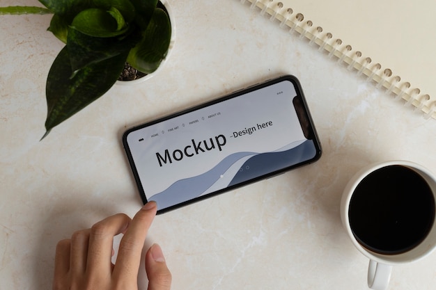 PSD person holding phone mockup