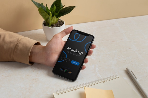 PSD person holding phone mockup