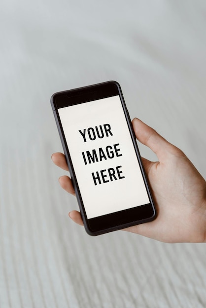 a person holding a phone that says your photography here here on the screen