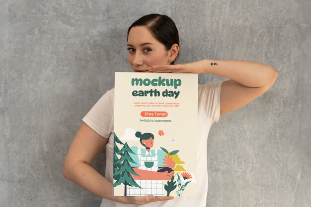 PSD person holding a signboard mockup for earth day