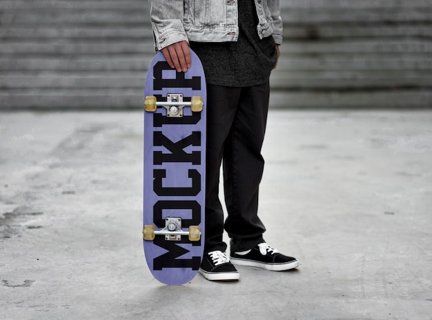 a person holding a skateboard with the word cel on it