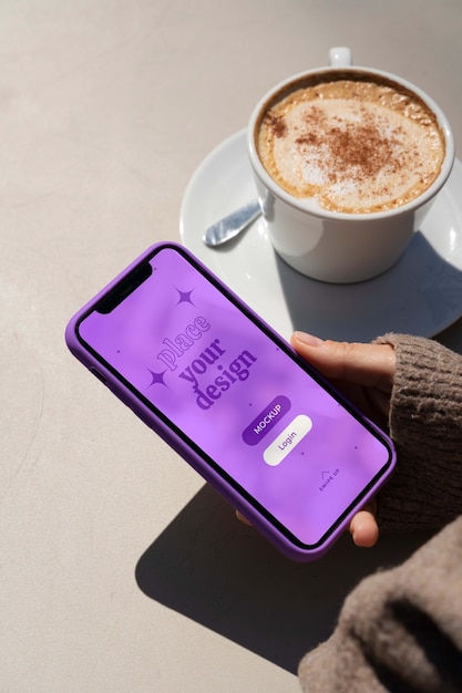 Person holding smartphone mock-up outdoors
