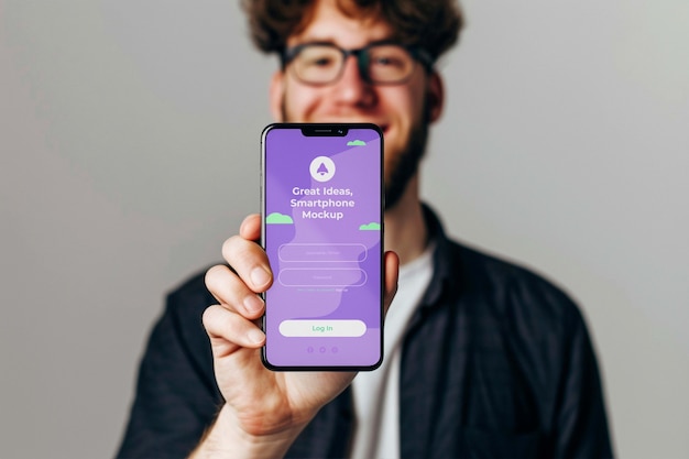 PSD person holding  smartphone mockup