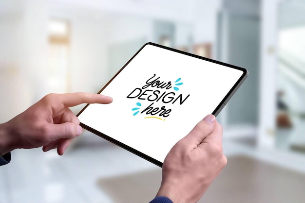 person holding a tablet with a blank screen for design presentation