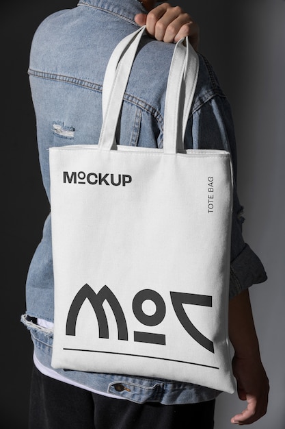 PSD person holding totebag mockup