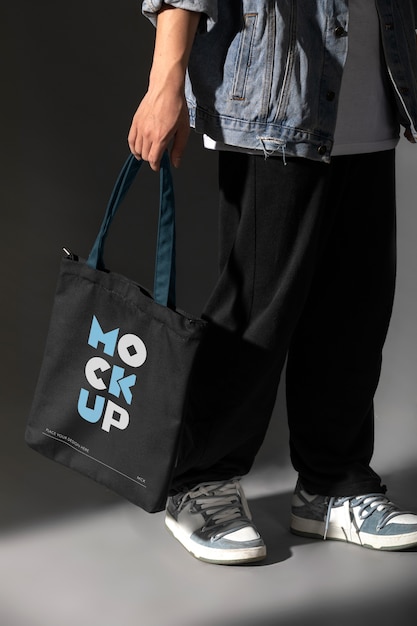 PSD person holding totebag mockup