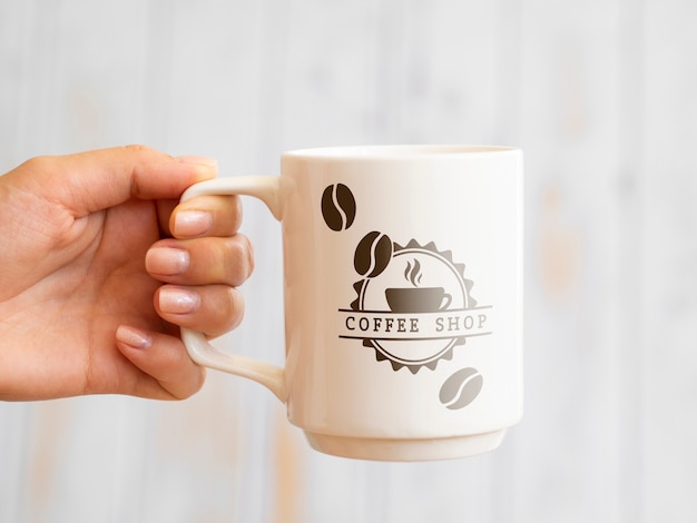 PSD person holding up a coffee mug