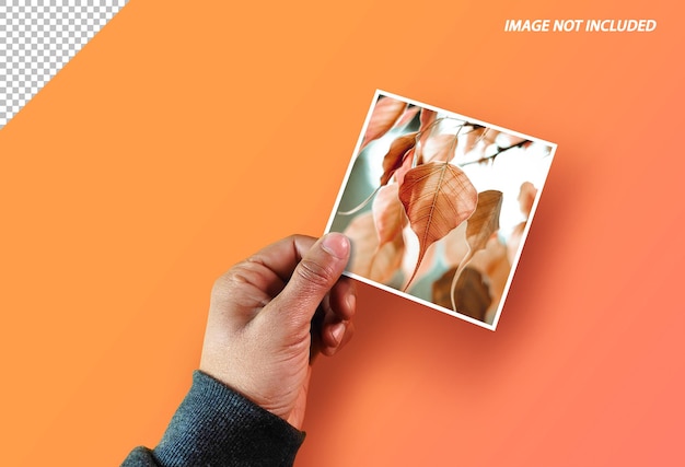 Person holds photo frame in her hand Realistic mockup fot text photo ad PSD