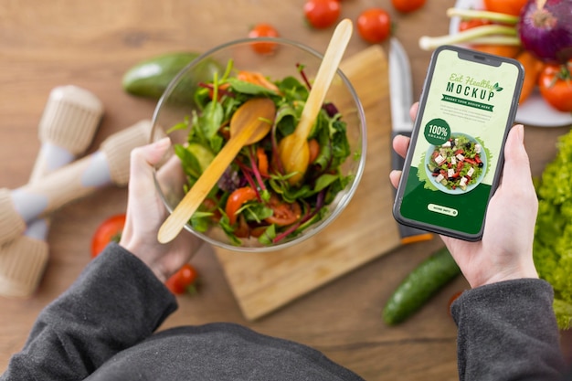 Person at home with bowl of salad