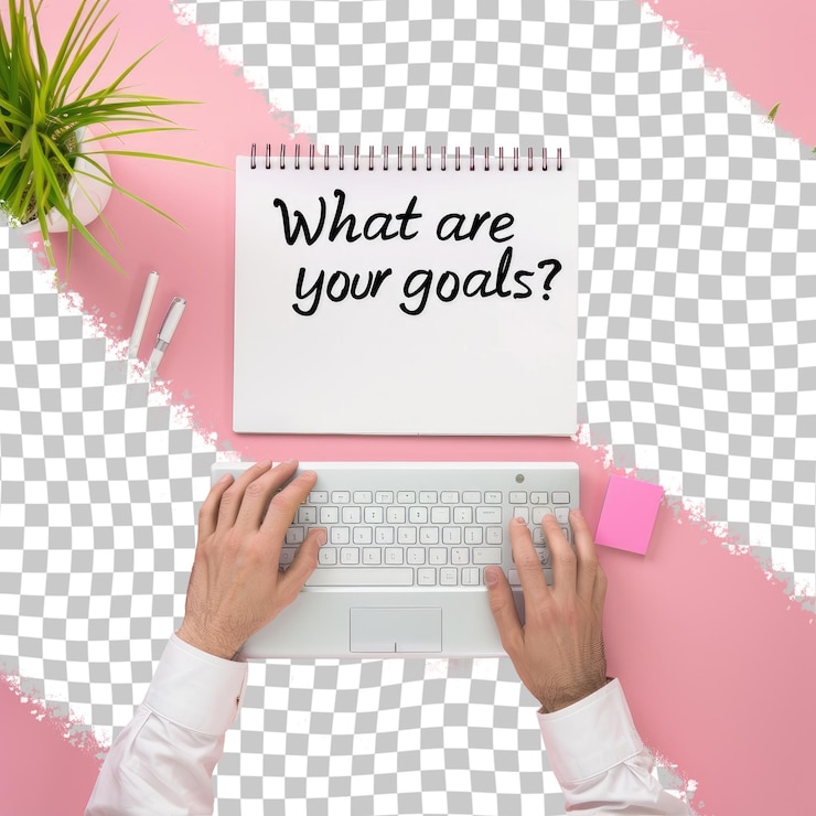 PSD a person is typing on a keyboard with a white paper that says what are your goals