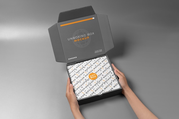 PSD person opening a paper box mock-up