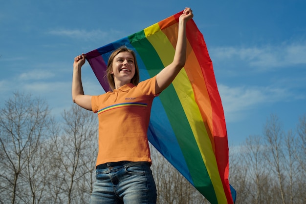 PSD person outdoors with rainbow pride flag