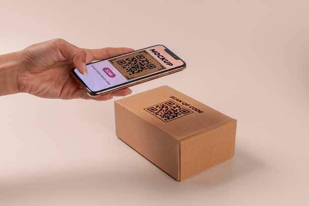 PSD person scanning qr code on cardboard box with smartphone