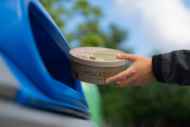 PSD person throwing away trash in recycling bin