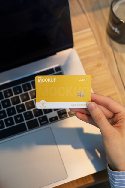 PSD person using credit card mock-up with laptop