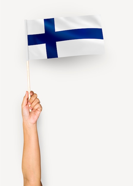 Person waving the flag of Republic of Finland