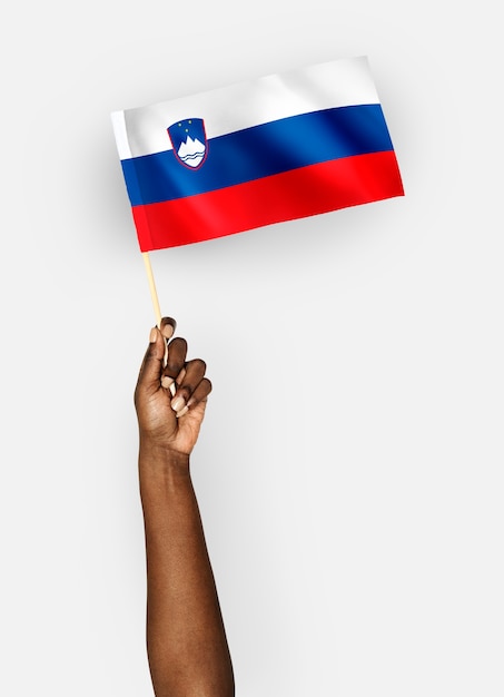 Person waving the flag of Republic of Slovenia