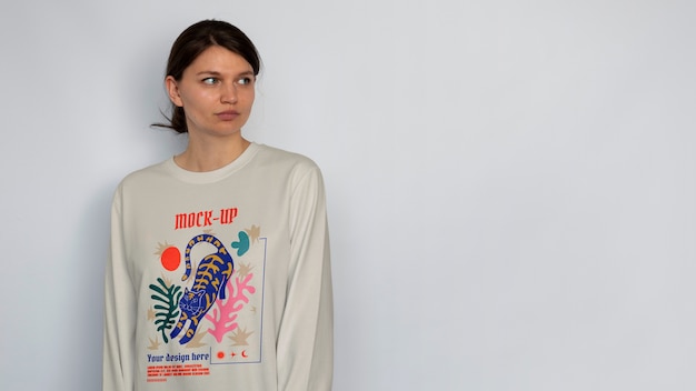 Person wearing long sleeve sweater mock-up design