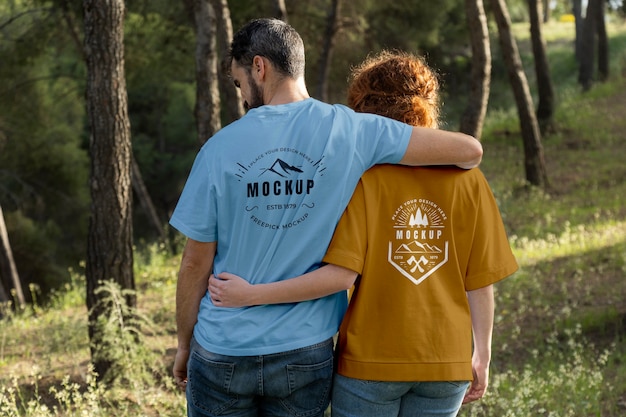 PSD person wearing mock-up t-shirt outdoors in nature