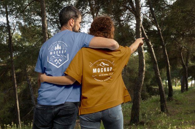 PSD person wearing mock-up t-shirt outdoors in nature