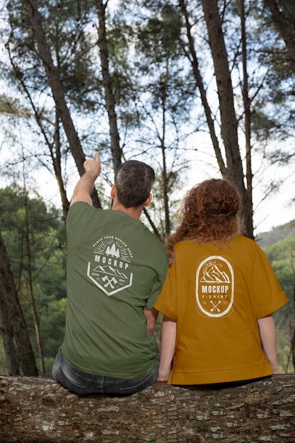 PSD person wearing mock-up t-shirt outdoors in nature