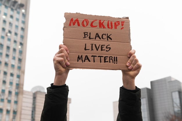 Person with a material recycled signboard mockup