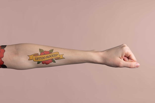 PSD person with tattoo mock-up on arm