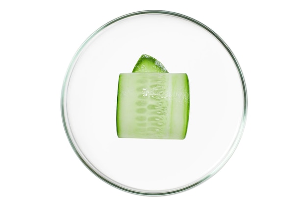 Petri dish isolated on empty background Cucumber slices in a Petri dish