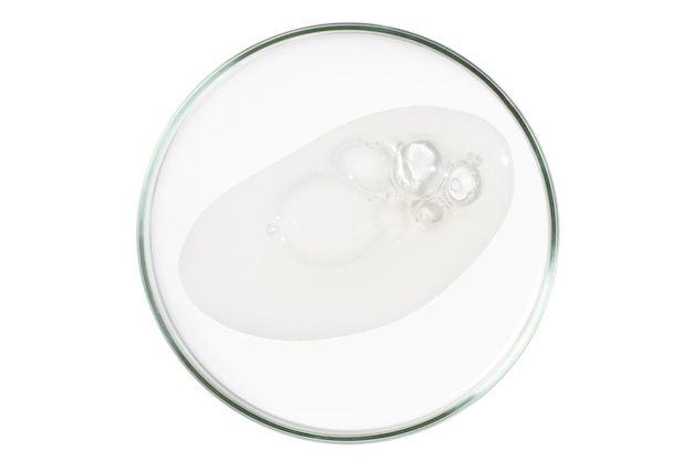 Petri dish isolated on empty background A smear of a transparent gel serum in a Petri dish