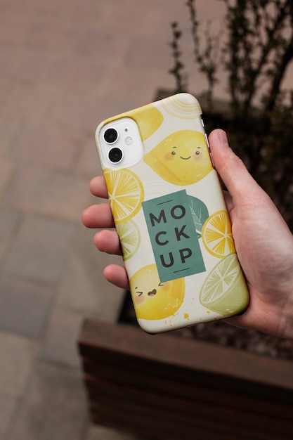 PSD phone case mockup held in hand