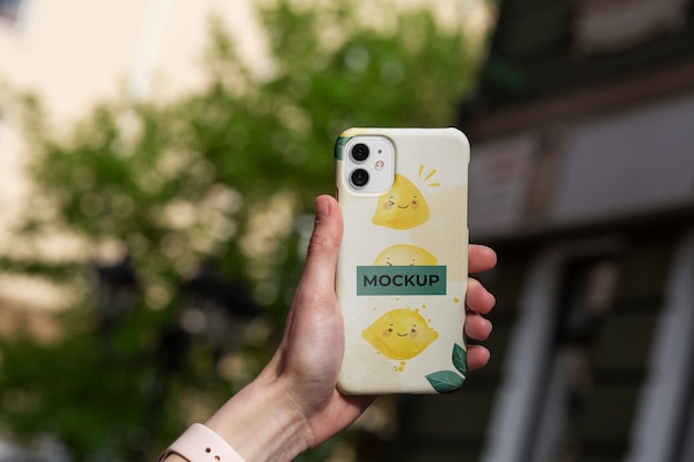 PSD phone case mockup held in hand