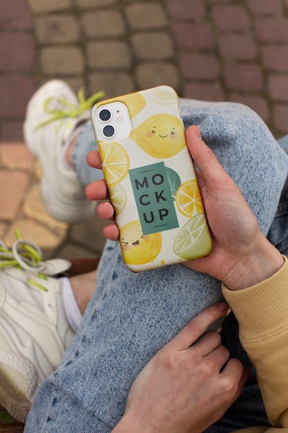 Phone case mockup held in hand