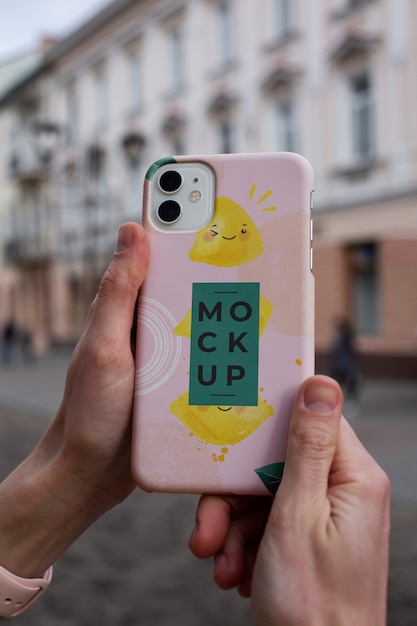 Phone case mockup held in hand