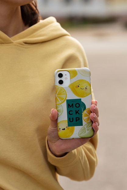 Phone case mockup held in hand