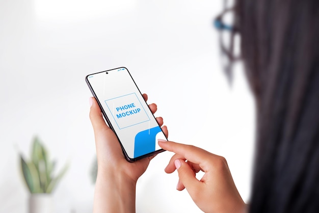 PSD phone mockup in woman hands