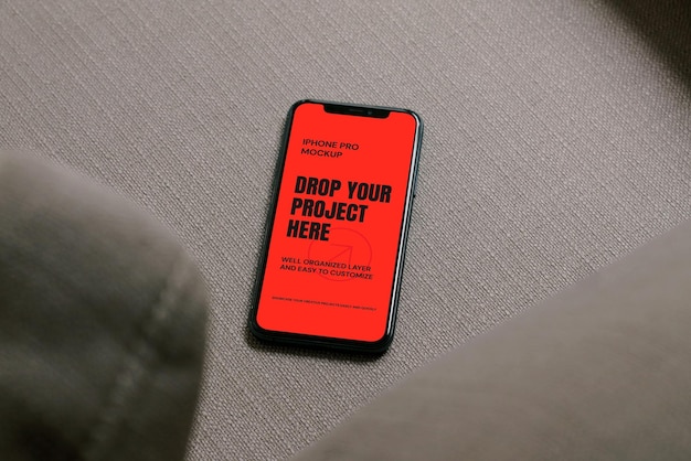 Phone Screen on Sofa Mockup Template