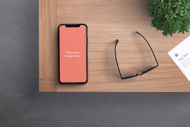 Phone with glasses on Desk Mockup