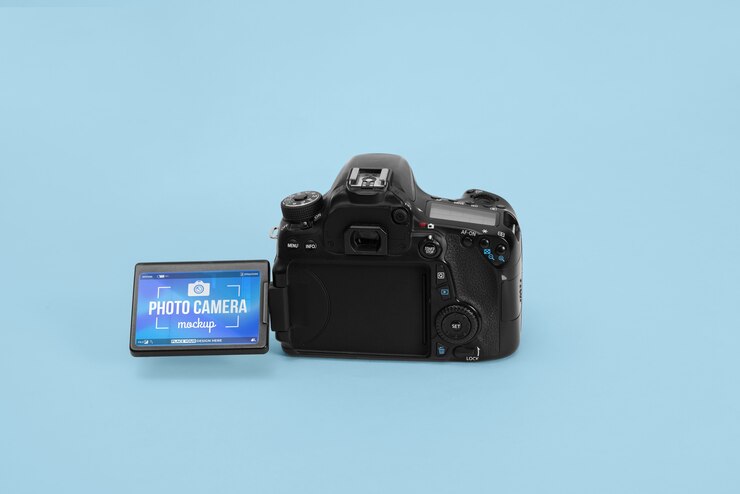 PSD photo camera with blue background mockup