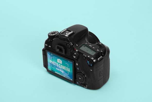 PSD photo camera with blue background mockup