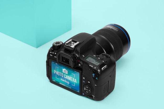 Photo camera with blue background mockup