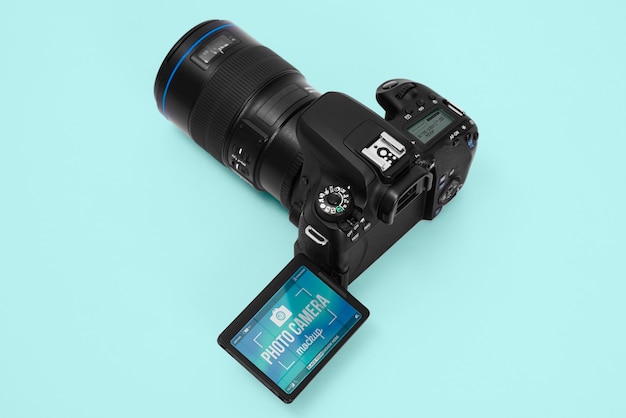 Photo camera with blue background mockup