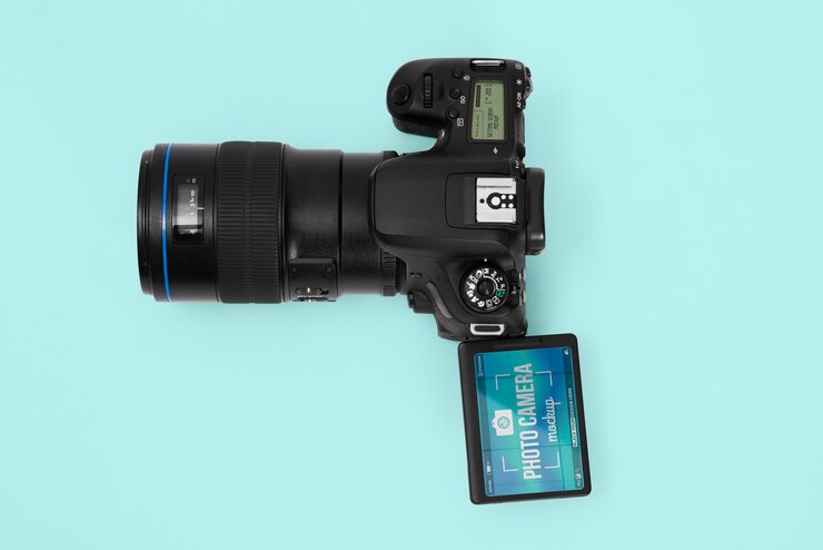 PSD photo camera with blue background mockup