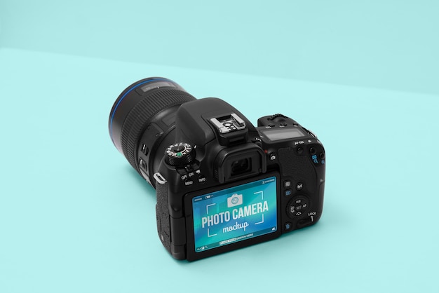 PSD photo camera with blue background mockup