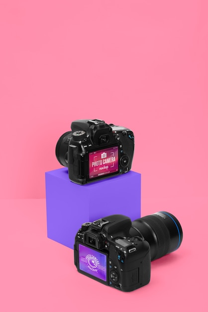 PSD photo camera with pink background mockup